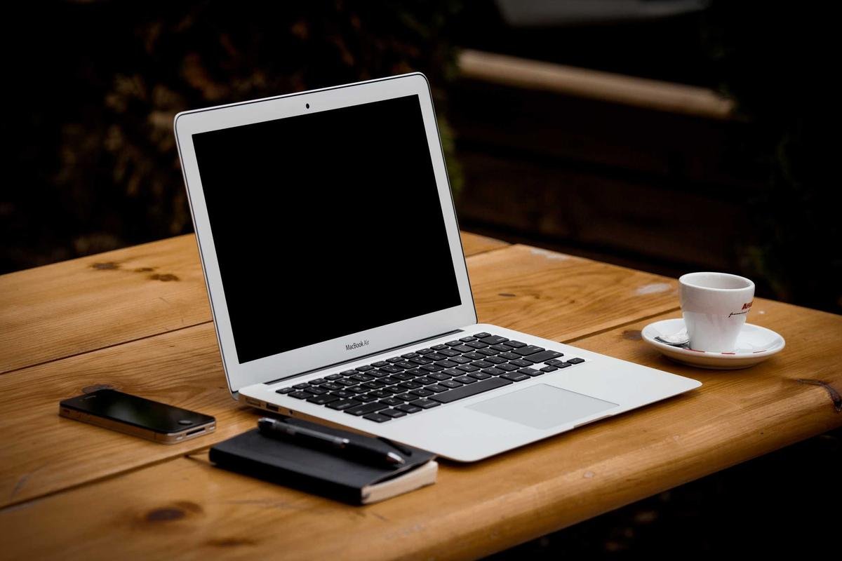 Developer writing SQL Server migration code on a laptop